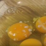 Omelet recipe with milk and eggs in a frying pan lush photo step by step